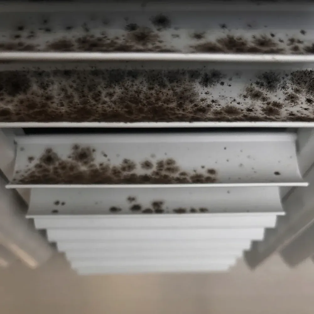 Ceiling air register showing discoloration around the grille